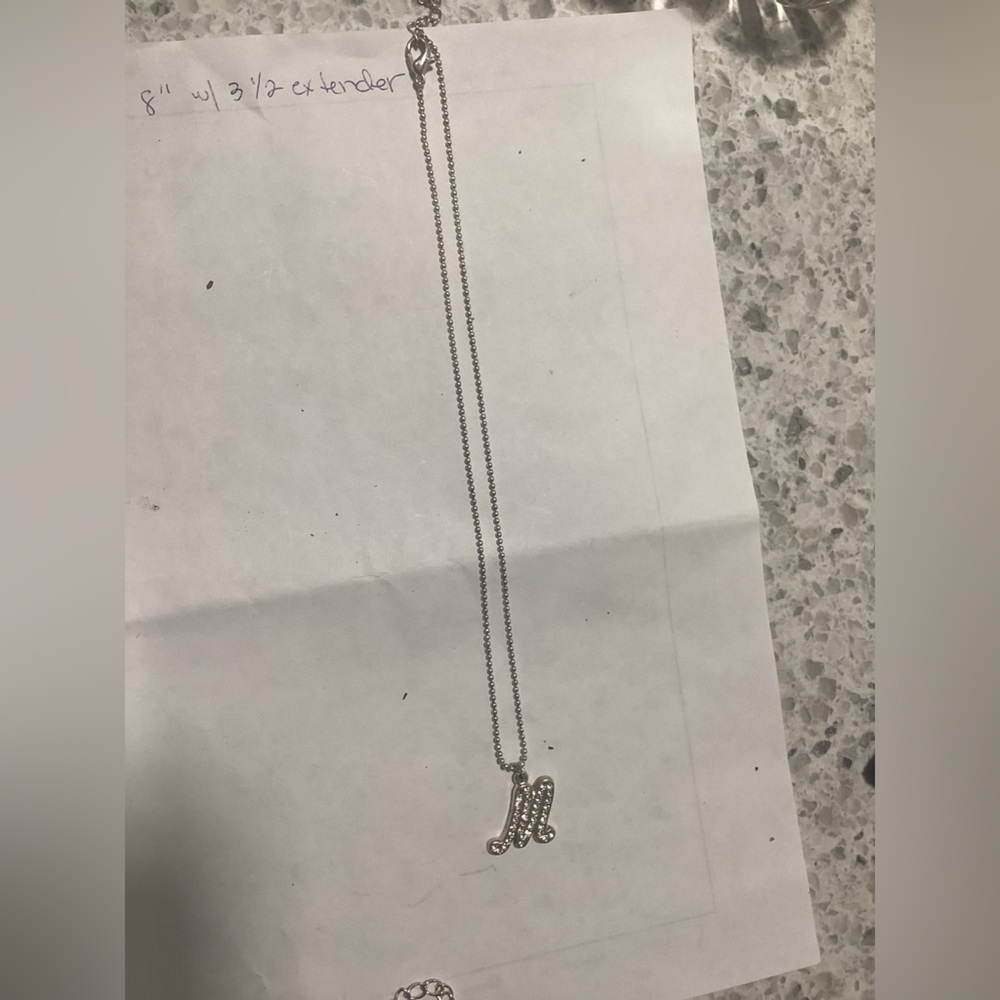 Elegant sterling Silver m Initial with stones in itNecklace